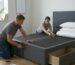 Step by step divan bed assembly guide showing base connection and setup in a UK bedroom