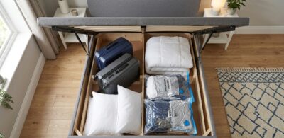 small double ottoman bed storage capacity with suitcases and bedding inside, UK
